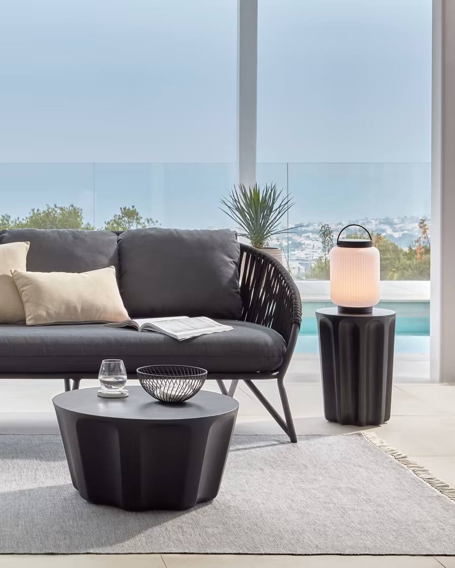 Kave Home Vilandra round outdoor side table made of concrete with black finish